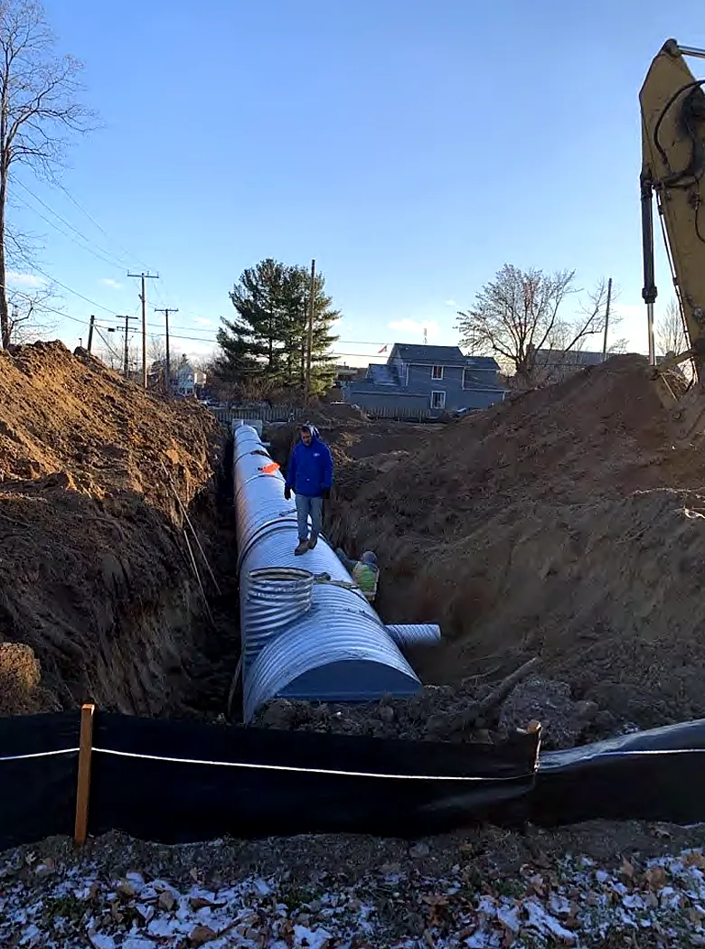 Large storm pipe laid in a long excavated trench